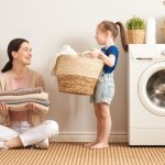 mom and daughter doing laundry routines together